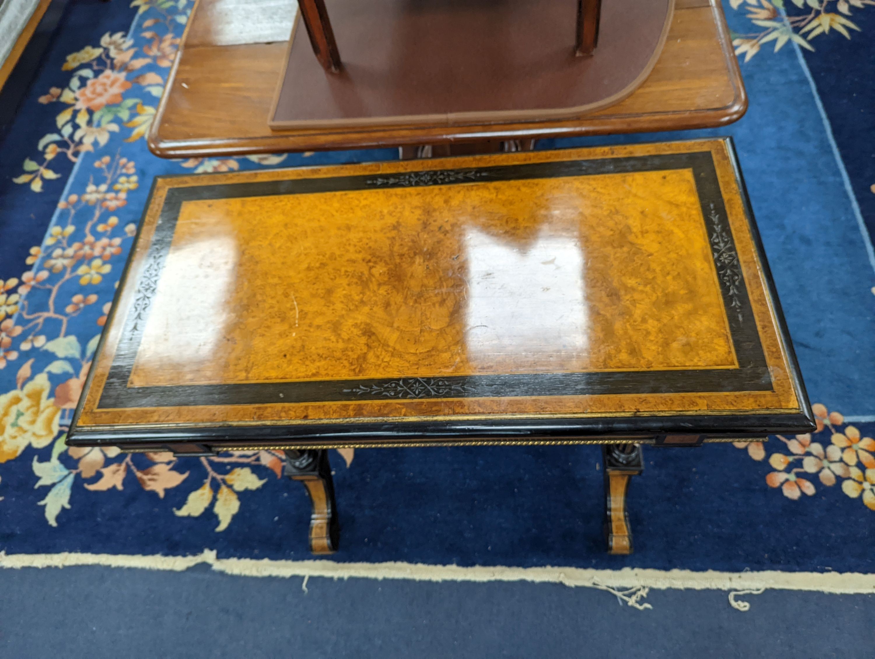 A Victorian part ebonised rectangular Amboyna folding card table, width 91cm, depth 46cm, height 77cm